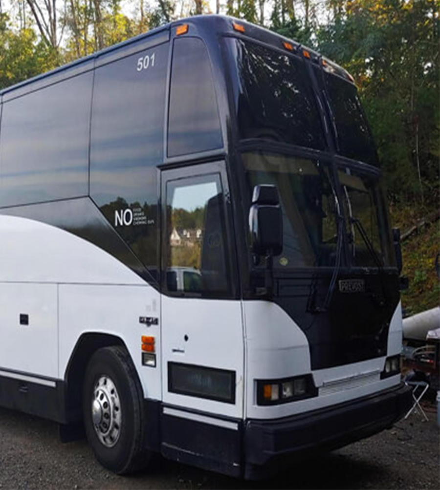 charter bus driving on the highway